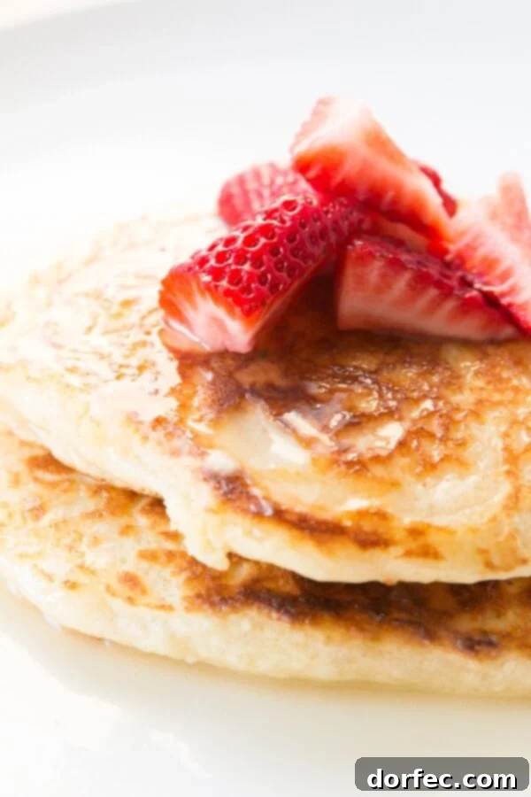 Rich and creamy Meyer Lemon Syrup, ready to pour over your favorite breakfast dishes like pancakes and waffles.