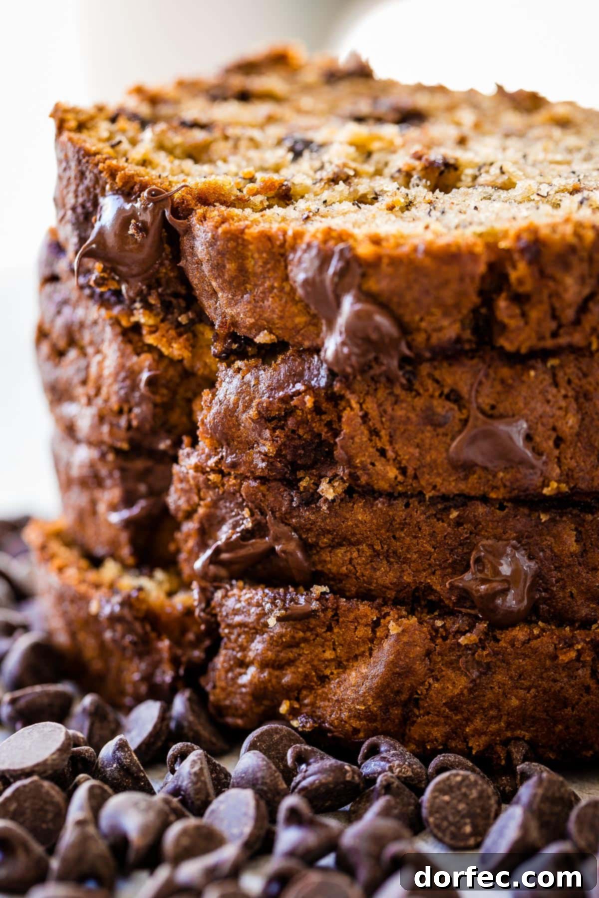 Close-up of a slice of Biscoff Banana Bread, highlighting its moist interior and the irresistible swirl of Biscoff flavor within. It's a comforting, tender, and incredibly delicious bread.