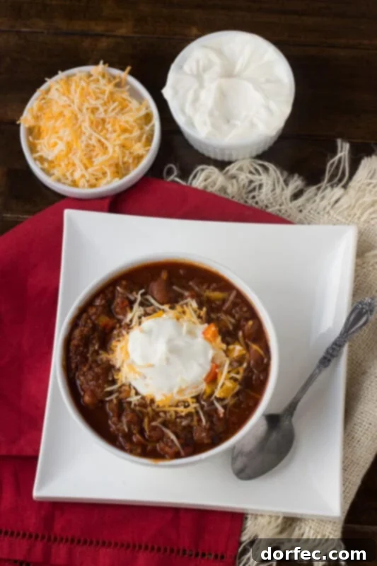 Close-up of hearty Dr Pepper and Chocolate Chili, garnished and ready to serve.