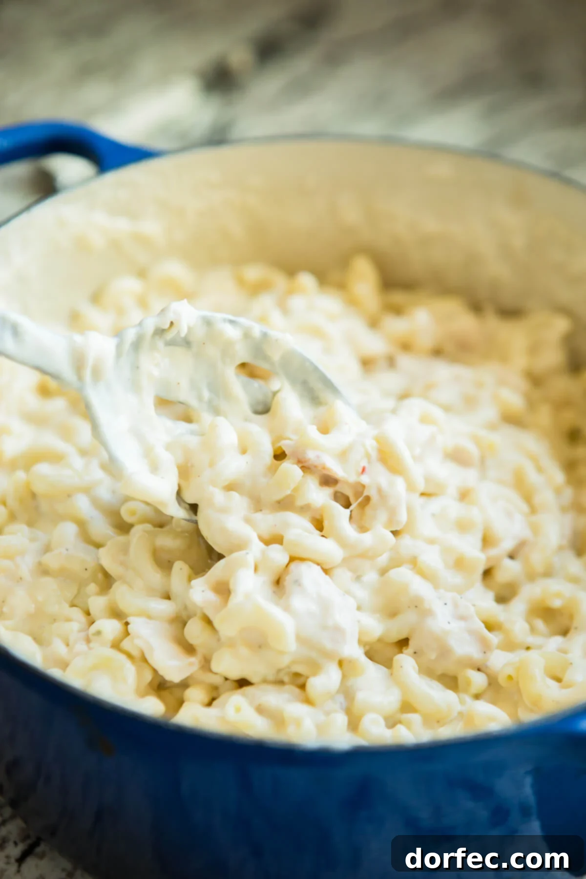 Loaded Chicken Bacon Ranch Macaroni and Cheese 6 A large pan of chicken mac and cheese in a Dutch oven, showcasing its creamy texture before baking