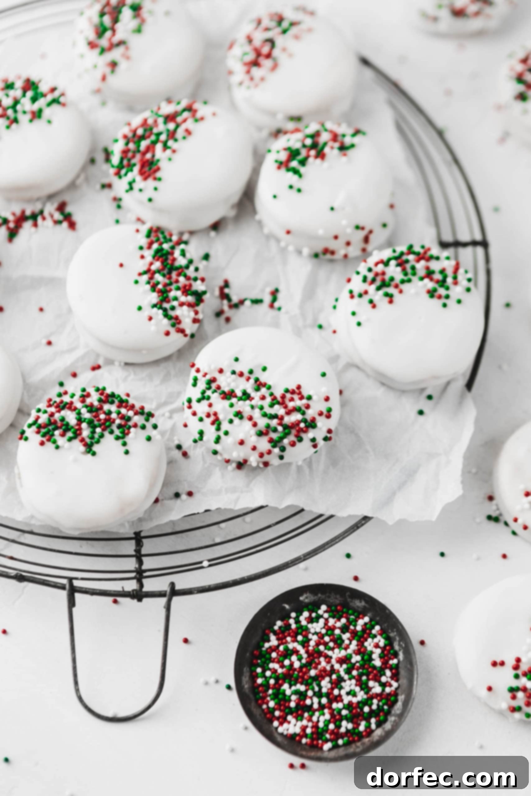 The easiest kid-friendly holiday candy to make: peanut butter filled Ritz crackers dipped in luscious white chocolate and adorned with festive sprinkles!