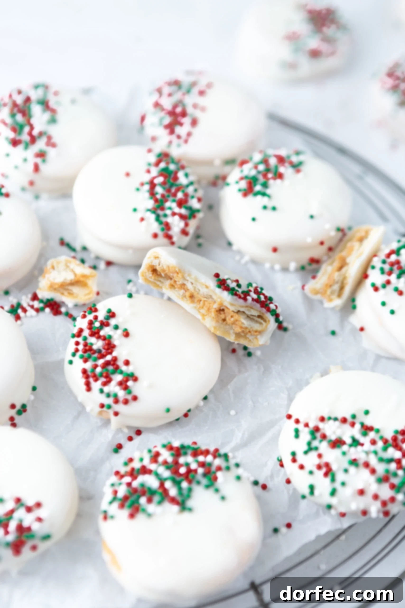 The easiest kid-friendly holiday candy to make: peanut butter filled Ritz crackers dipped in luscious white chocolate and adorned with festive sprinkles!