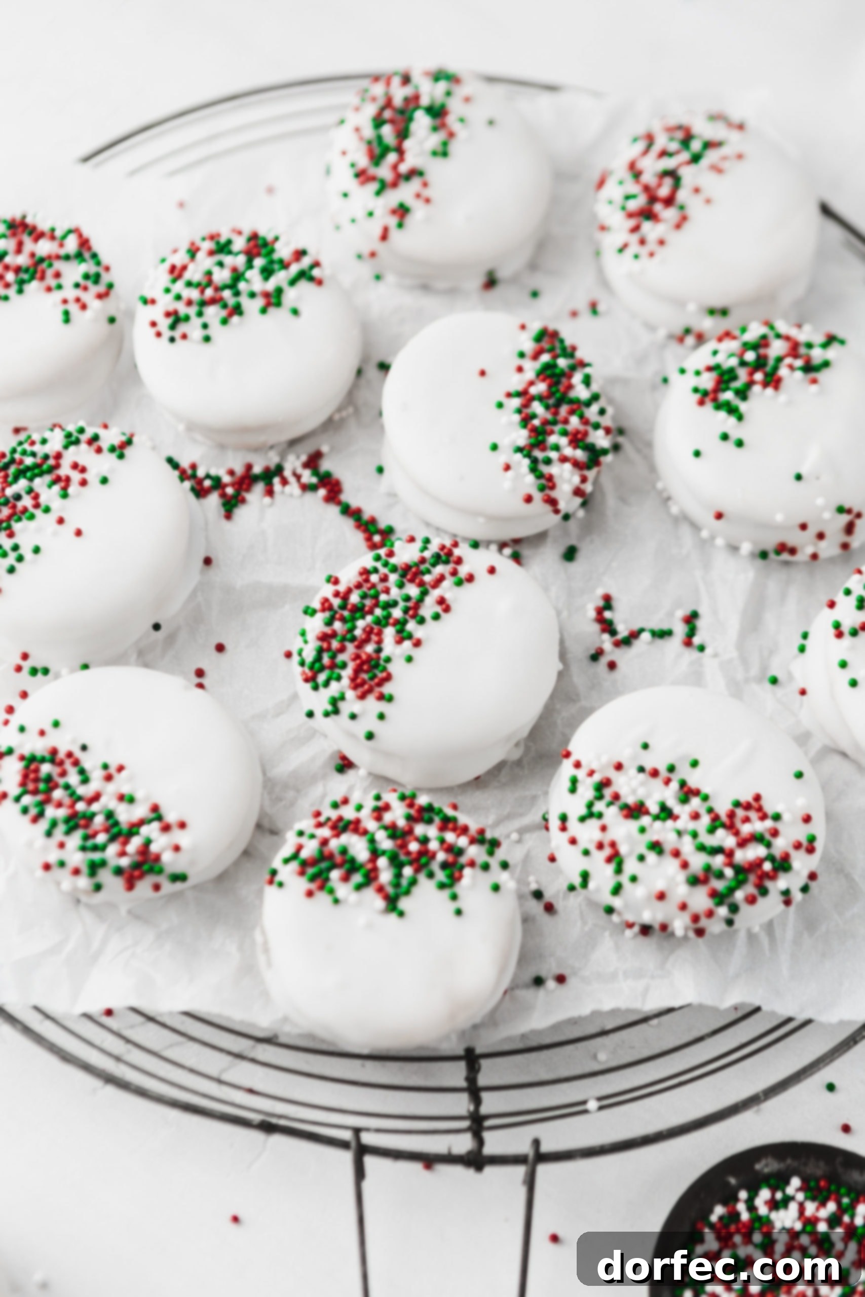 The easiest kid-friendly holiday candy to make: peanut butter filled Ritz crackers dipped in luscious white chocolate and adorned with festive sprinkles!