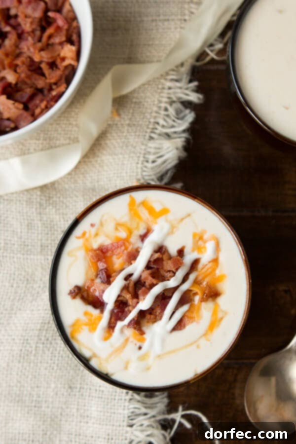 Golden Loaded Baked Potato Soup with a hint of honey drizzle, a secret ingredient