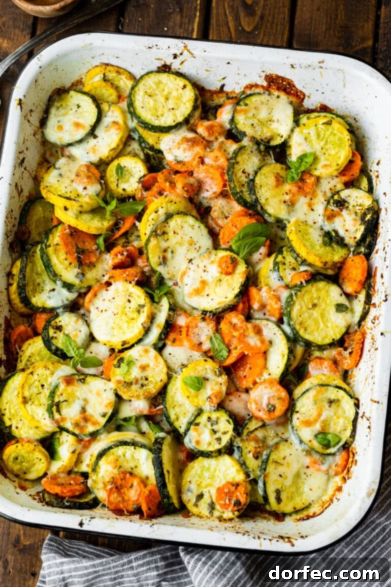 a photo of a large baking dish filled with roasted cheesy basil vegetables
