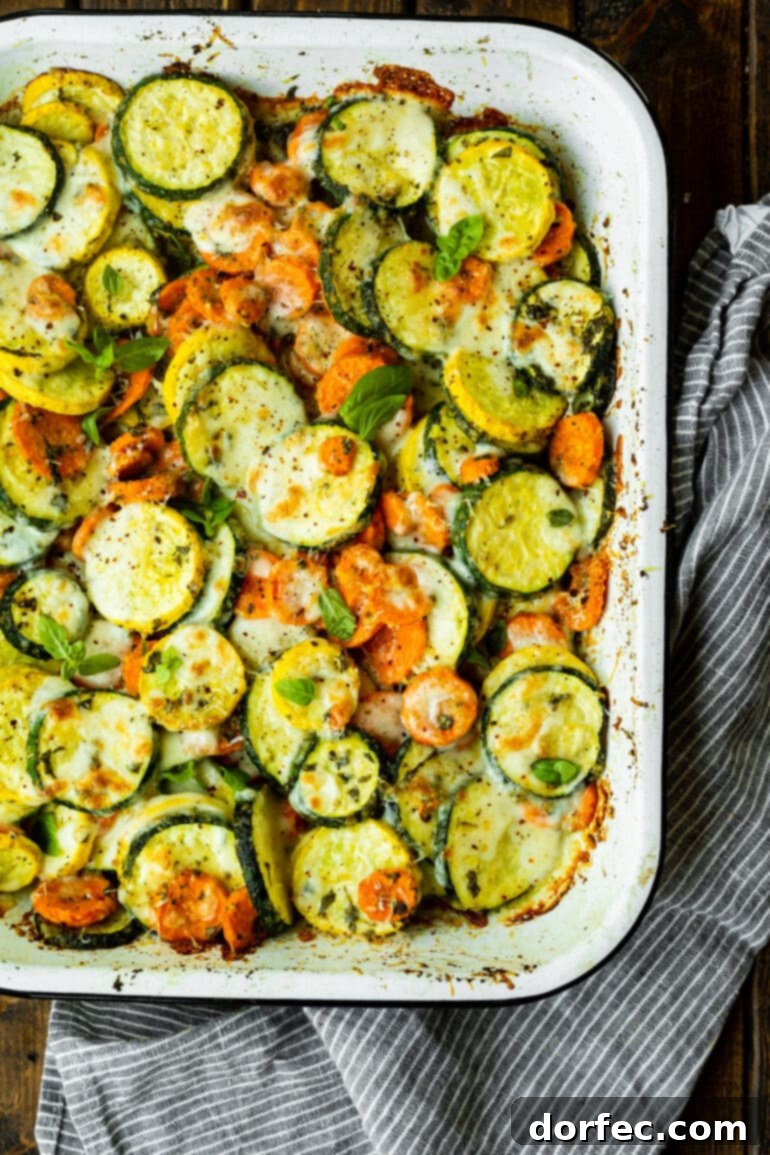 a photo of baked summer produce with a crispy melty topping