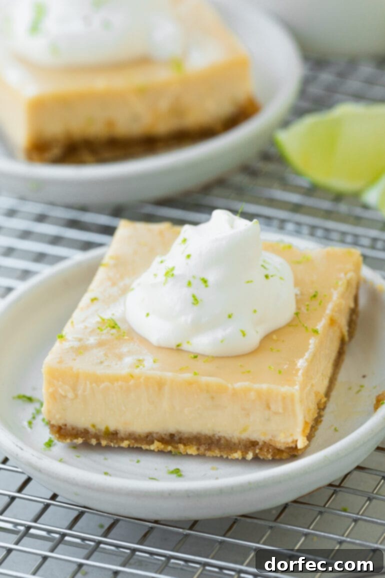 Key Lime Pie Bars 5 A photo of a key lime pie bar sitting on a small dessert plate.