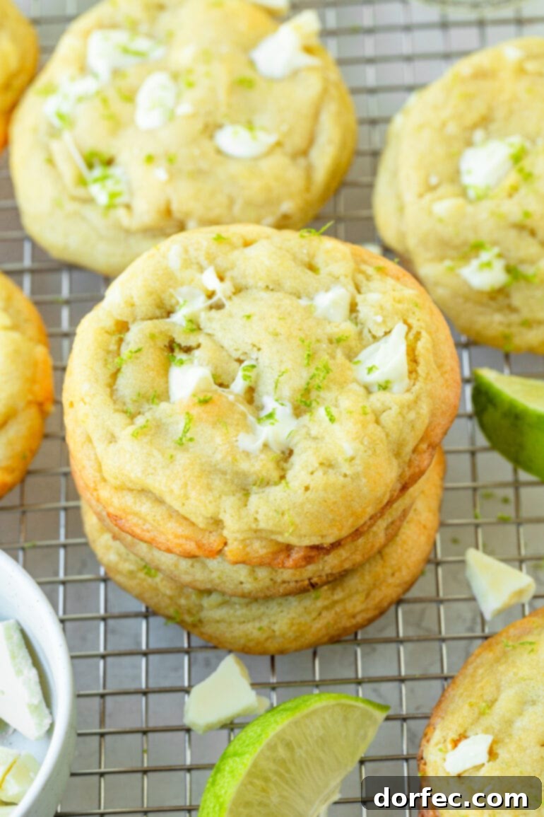 a photo of a stack of golden baked white chocolate key lime cookies