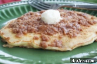 Delicious stack of Cinnamon Streusel Pancakes topped with streusel