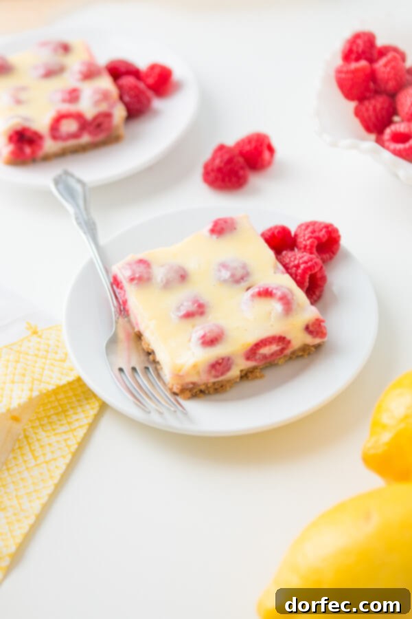 Lemon Raspberry Bars with a buttery graham cracker crust!