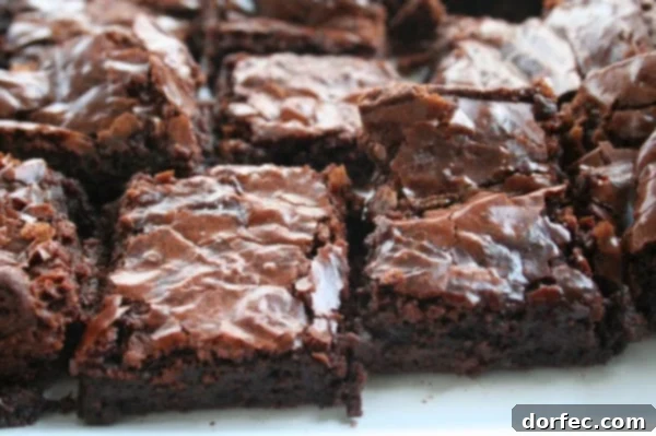 Deliciously rich chocolate brownies on a cooling rack, freshly baked and ready to be enjoyed.