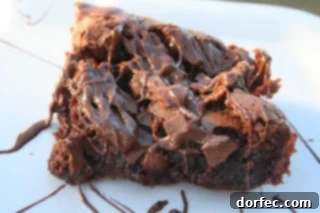 Rich, fudgy caramel Nutella hazelnut brownies with a glossy topping, cut into perfect squares for a luxurious dessert.