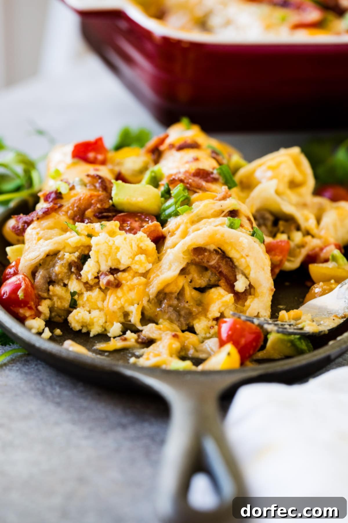 Cheesy egg and sausage breakfast enchiladas casserole to feed a crowd ohsweetbasil.com
