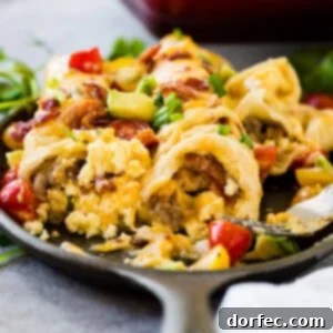 Cheesy egg and sausage breakfast enchiladas casserole to feed a crowd ohsweetbasil.com