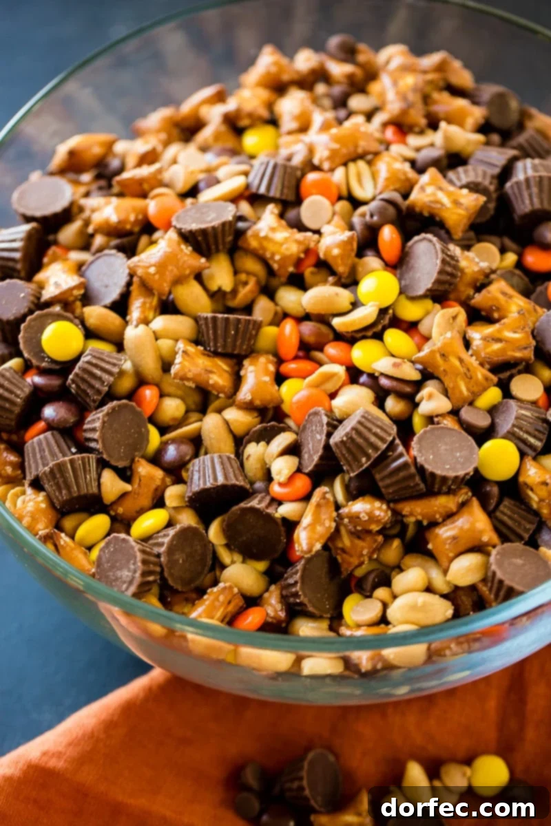 A large serving bowl filled with the freshly mixed Reese's Snack Mix, highlighting its appeal as a festive snack.