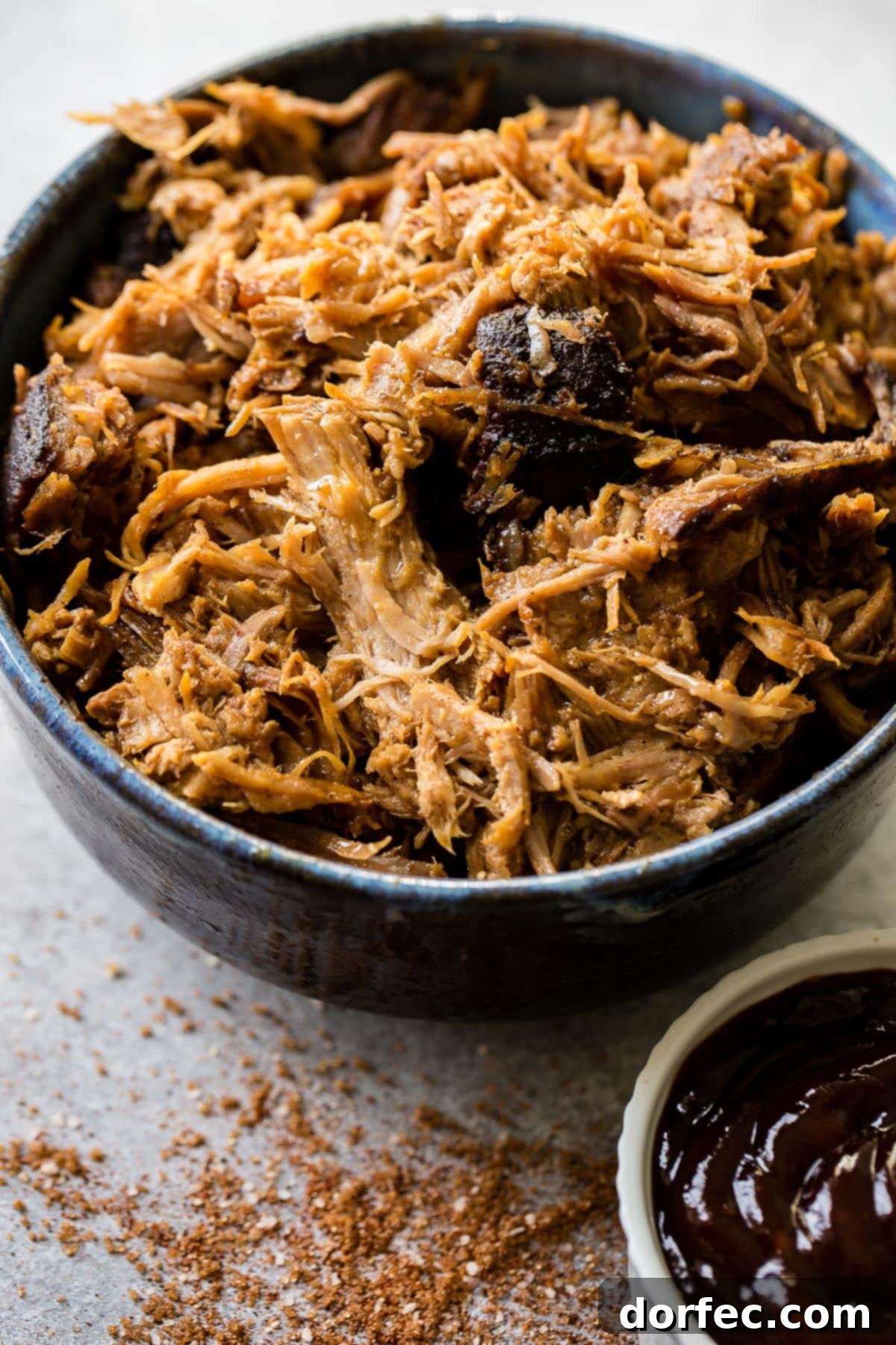 Traeger Smoked Pulled Pork Perfection 2 Perfectly smoked pulled pork resting on a Traeger grill