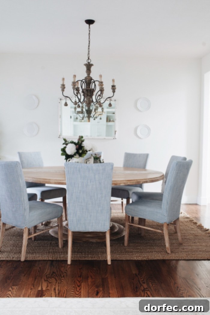 A natural weave fiber rug from RugsUSA, the Maui Chunky Loop, provides texture and warmth to this French Country dining room.