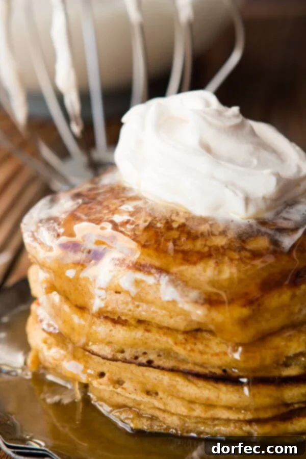 Melt in your mouth, fluffy, whole wheat pumpkin pie pancakes with cinnamon caramel syrup (that's to die for) ohsweetbasil.com