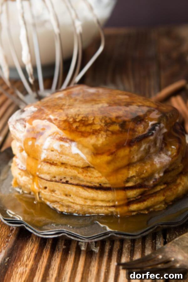 Melt in your mouth, fluffy, whole wheat pumpkin pie pancakes with cinnamon caramel syrup (that's to die for) ohsweetbasil.com