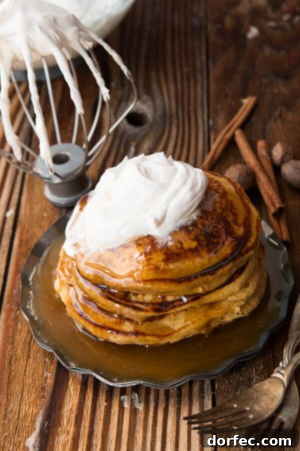 Melt in your mouth, fluffy, whole wheat pumpkin pie pancakes with cinnamon caramel syrup (that's to die for) ohsweetbasil.com