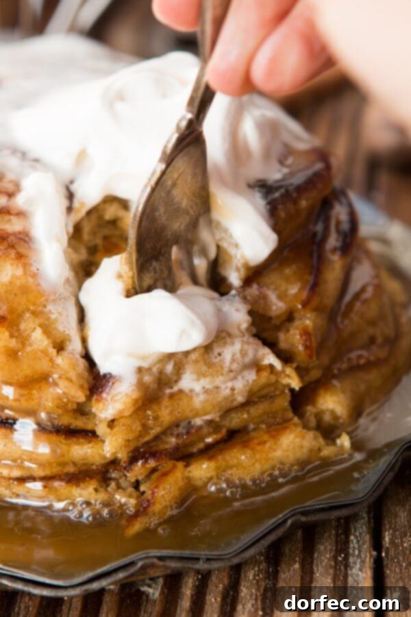 Melt in your mouth, fluffy, whole wheat pumpkin pie pancakes with cinnamon caramel syrup (that's to die for) ohsweetbasil.com