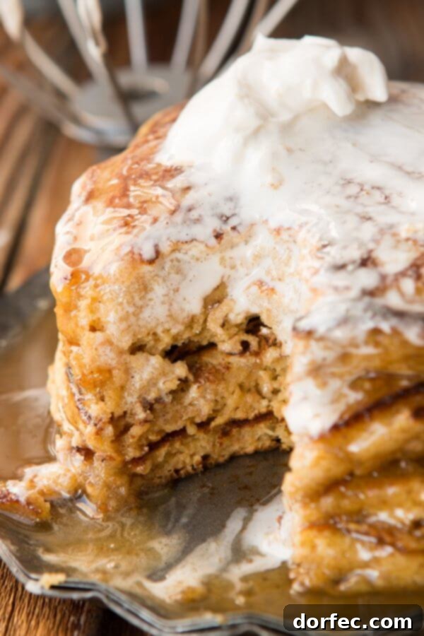 Melt in your mouth, fluffy, whole wheat pumpkin pie pancakes with cinnamon caramel syrup (that's to die for) ohsweetbasil.com