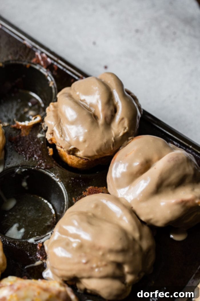 Pillowy Maple Glazed Cinnamon Butterflake Rolls 5 An old muffin tin filled with maple cinnamon butterflake rolls