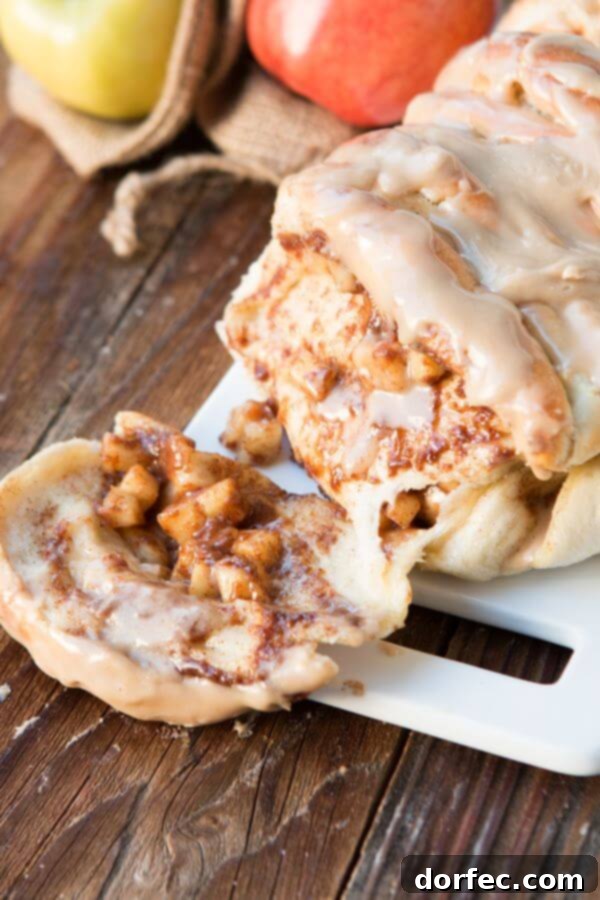 Pillowy Maple Glazed Cinnamon Butterflake Rolls 8 Apple Pie Pull Apart Bread with Maple Glaze and two apples in the background