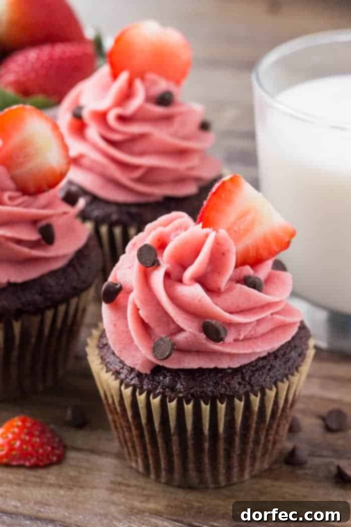 These chocolate cupcakes with strawberry frosting start with moist, fudgy chocolate cake, then topped with creamy strawberry buttercream made from real strawberries. Perfect for Valentine's Day.