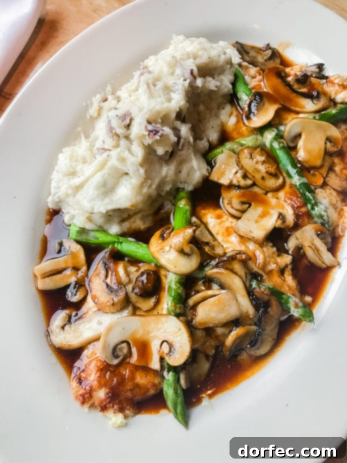 The Cheesecake Factory's famous Chicken Madeira, a popular and rich entree with mushrooms and a savory sauce.