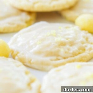 Soft and chewy lemon drop cookies are the perfect treat for those lemon lovers out there! A light glaze on top and a sprinkle of crushed lemon drops! ohsweetbasil.com