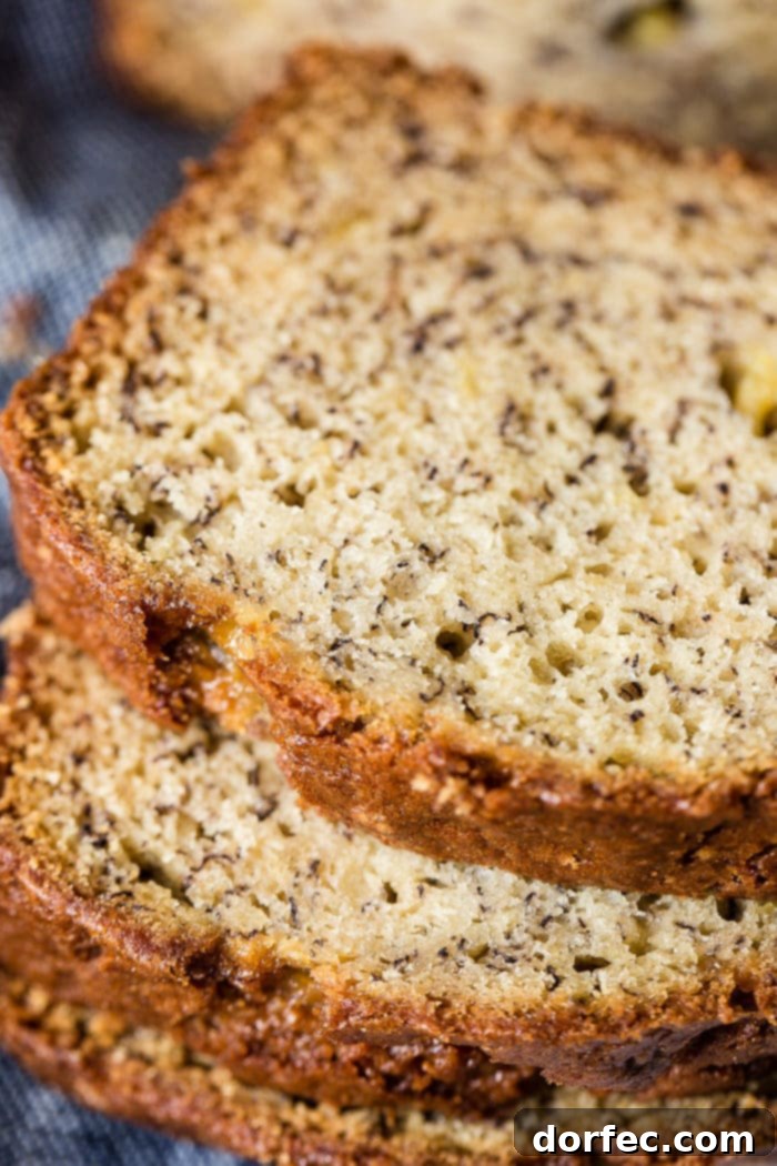Irresistible Sour Cream Banana Bread 3 Slices of incredibly moist sour cream banana bread stacked artfully