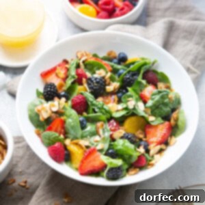 A vibrant Spinach Berry Salad with Lemon Dressing