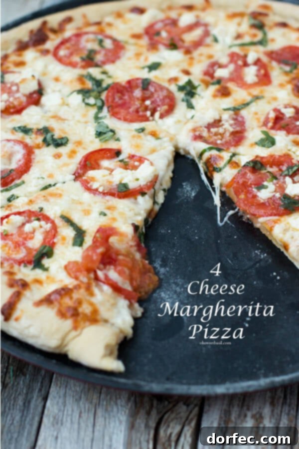 Four cheese Margherita pizza with fresh basil and a golden crust.