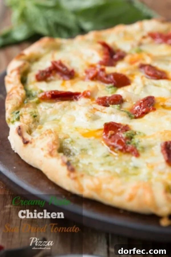 Creamy pesto chicken pizza with sun-dried tomatoes on a delicious thin crust