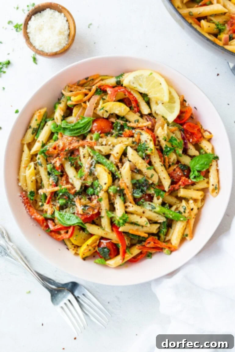 Vibrant Spring Pasta Primavera Recipe 5 A captivating photo of a large serving bowl overflowing with brightly colored Pasta Primavera, showcasing a beautiful mix of pasta and fresh vegetables.
