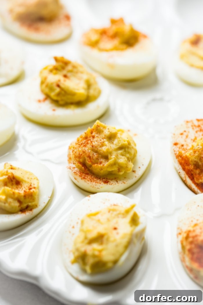 The Ultimate Creamy Deviled Eggs 4 A white deviled eggs platter with the best deviled eggs ever