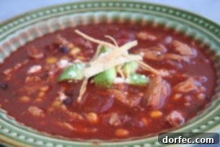 A steaming bowl of comforting homemade soup, garnished with fresh herbs and served on a rustic table, inviting warmth and deliciousness.