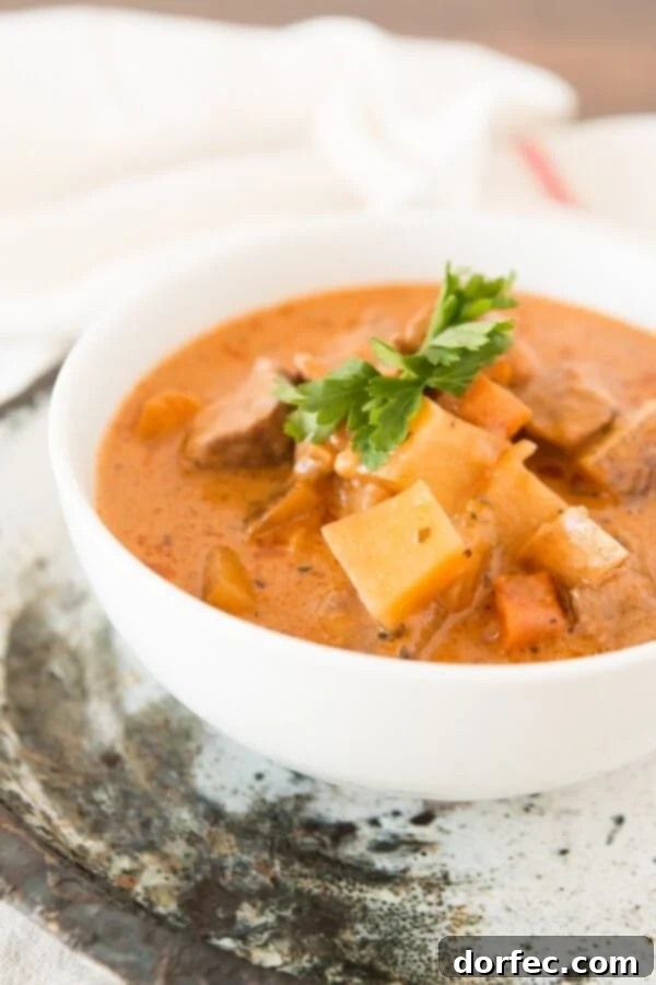 Delicious Beef Stew with Secret Ingredients Close-up of slow-cooked beef stew with carrots, potatoes, and mushrooms.