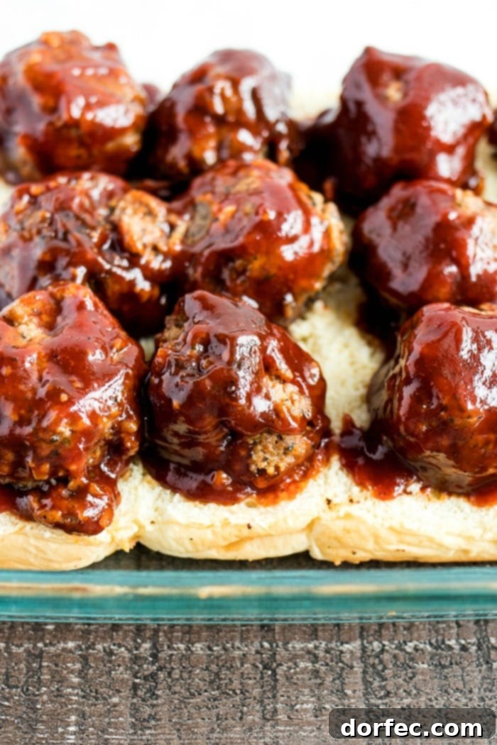 bbq meatballs on slider buns in baking dish