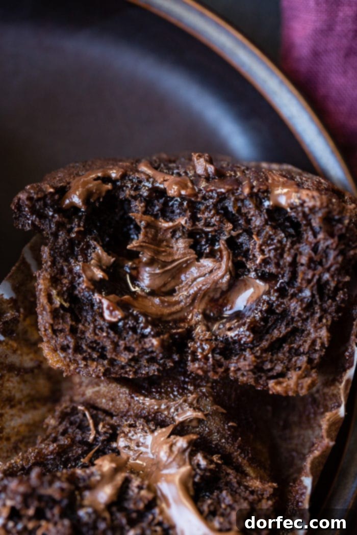 A tray of freshly baked Nutella stuffed chocolate banana muffins