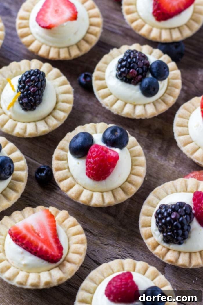 Easy mini fruit tarts made with frozen tart shells, sweet vanilla pudding filling, and fresh fruit.