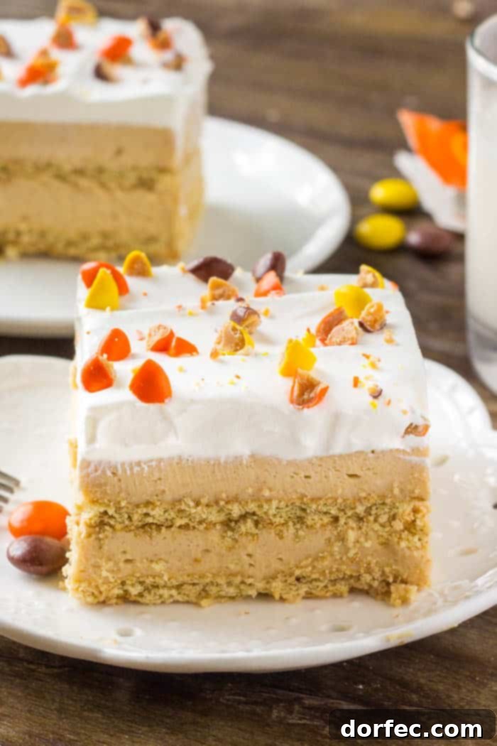 This peanut butter icebox cake just might be the perfect dessert for summer. Cold & creamy layers of peanut butter filling between graham crackers. Then topped with whipped topping and tons of peanut butter candies.