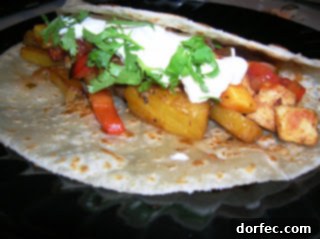 Delicious Pineapple Fajitas with chicken, peppers, and mango salsa
