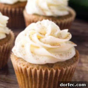 Zucchini cupcakes with cream cheese frosting are super moist with a delicious spice cake flavor and fluffy cream cheese buttercream.