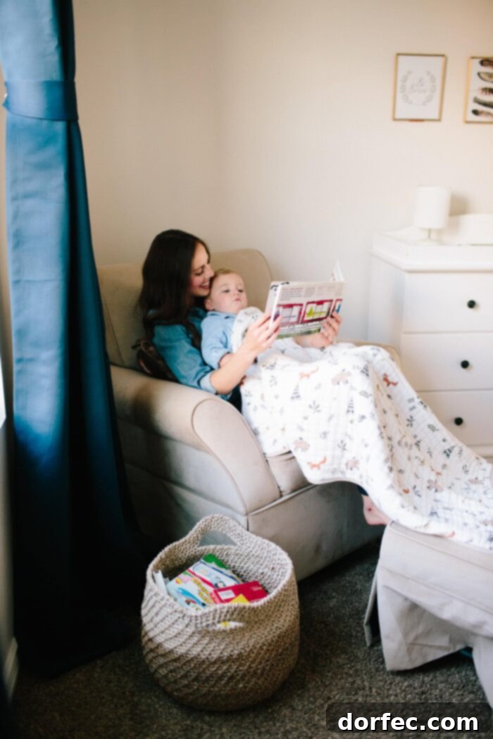 A toddler reading a book with an adult