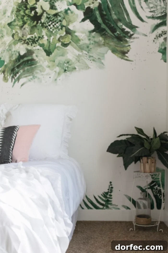 Corner of a beach themed tween bedroom with a faux plant and stylish white decor