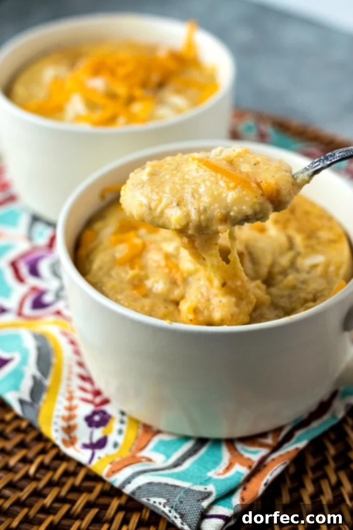 Creamy Southern Cheesy Grits 4 Another close-up of Cheesy Southern Grits, emphasizing the luxurious creaminess and the abundance of melted cheese, perfect for a hearty meal.