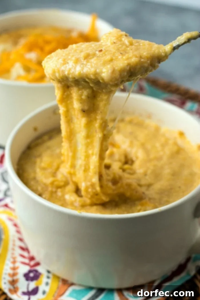 Creamy Southern Cheesy Grits 5 An overhead view of a bowl of Cheesy Southern Grits, showcasing the smooth, velvety texture and the inviting golden hue, ready to be enjoyed.