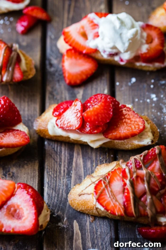 Golden Brown Sugar Strawberry Crostini 2 A brown board featuring elegantly arranged Brown Sugar Strawberry Crostinis, each adorned with a generous chocolate drizzle.